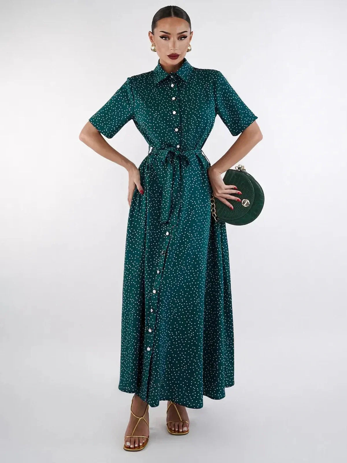 Emerald Dot Midi Dress featuring a cinched waist, V-neckline, and white polka dots, perfect for elegant occasions.