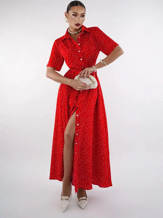 Model showcasing a vibrant red midi dress with polka dots and a high slit, perfect for summer occasions or cocktail events.