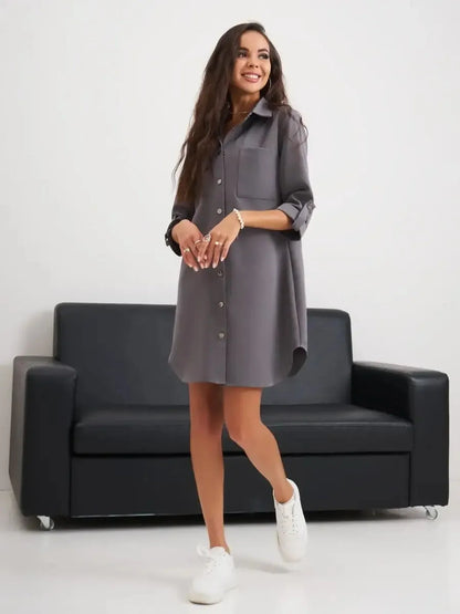 Model wearing a grey mini dress styled with sneakers, showcasing relaxed elegance for summer outings.