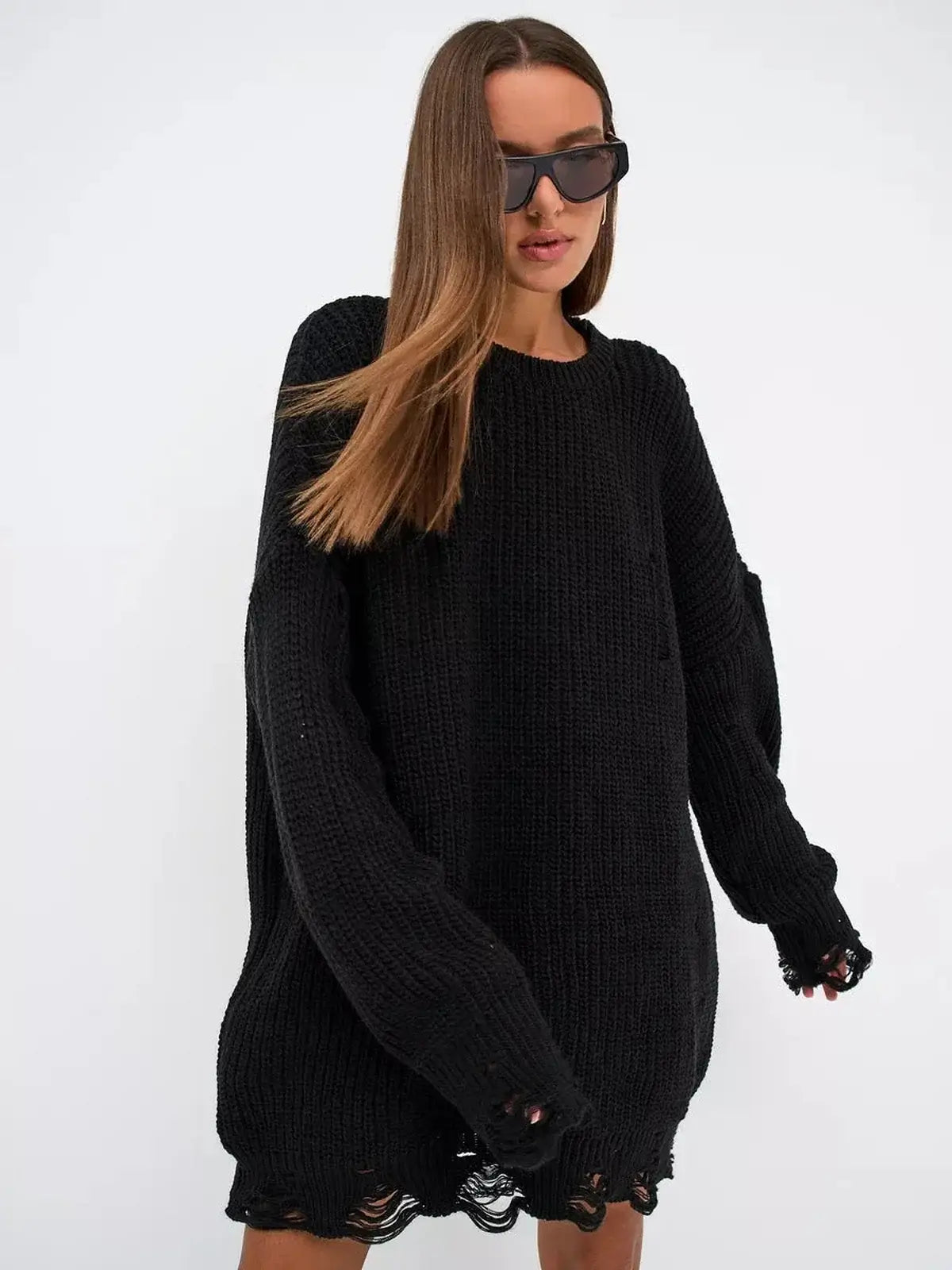 Oversized black Shadow Knit Mini dress featuring distressed texture and long sleeves, showcasing bold fashion style.