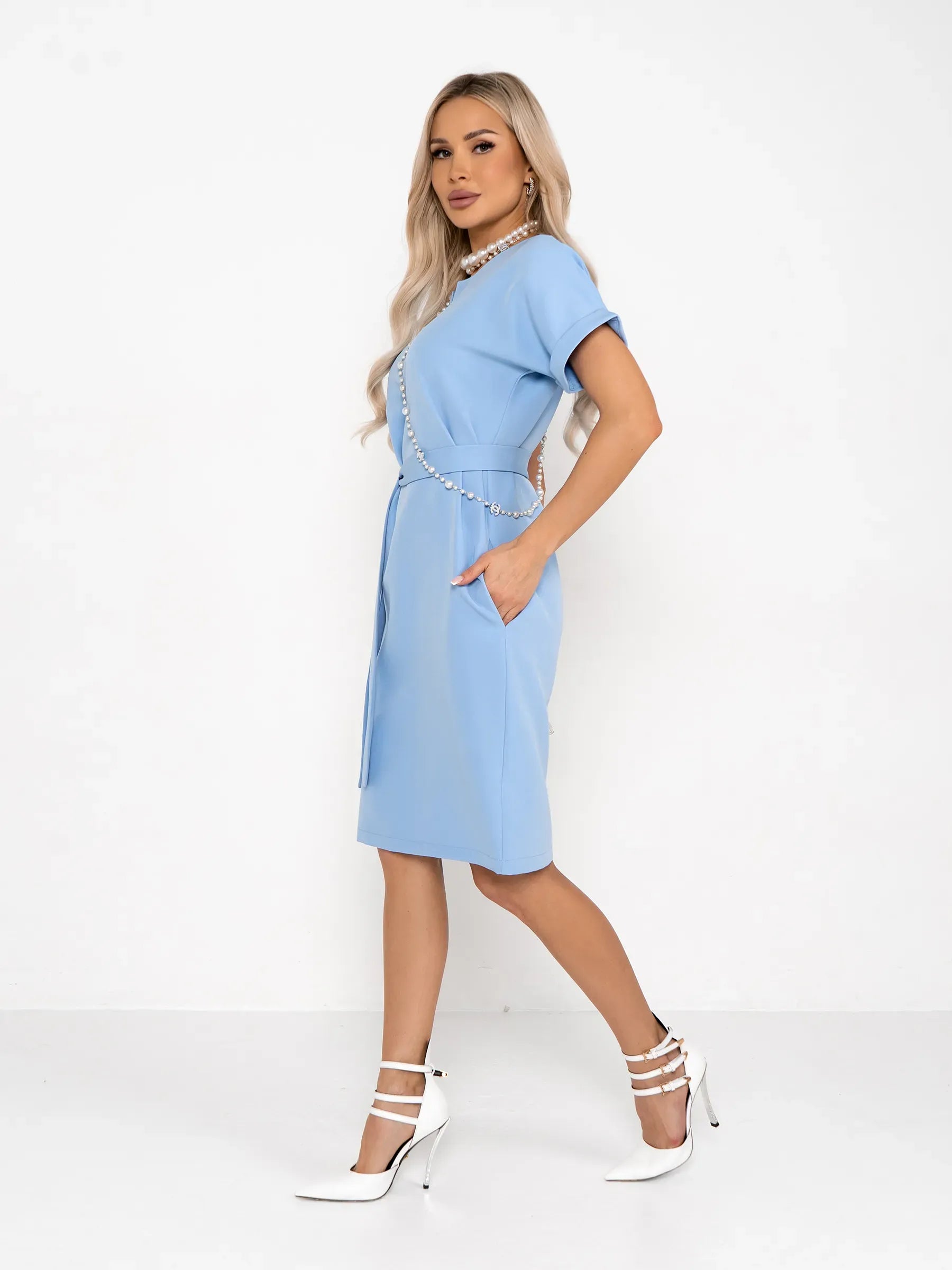 Light blue mini dress with rolled short sleeves and optional self-tie belt, perfect for summer and versatile occasions.
