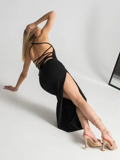 Women’s Noir Lace Midi Dress featuring an open lace-up back and thigh-high slit for an elegant, seductive look.