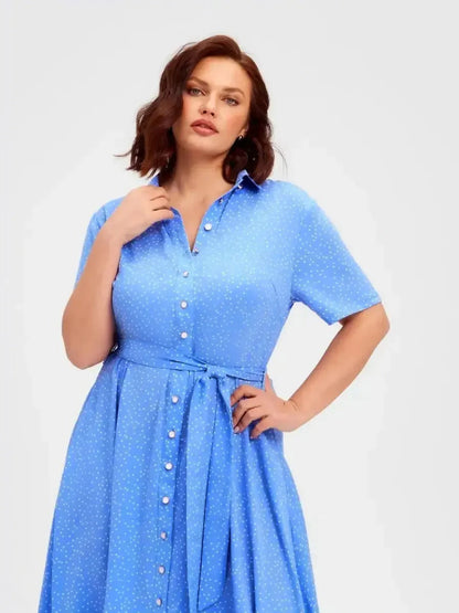 Skyline Dot Midi Dress in light blue with polka dots, featuring a button front and adjustable waist for summer elegance.