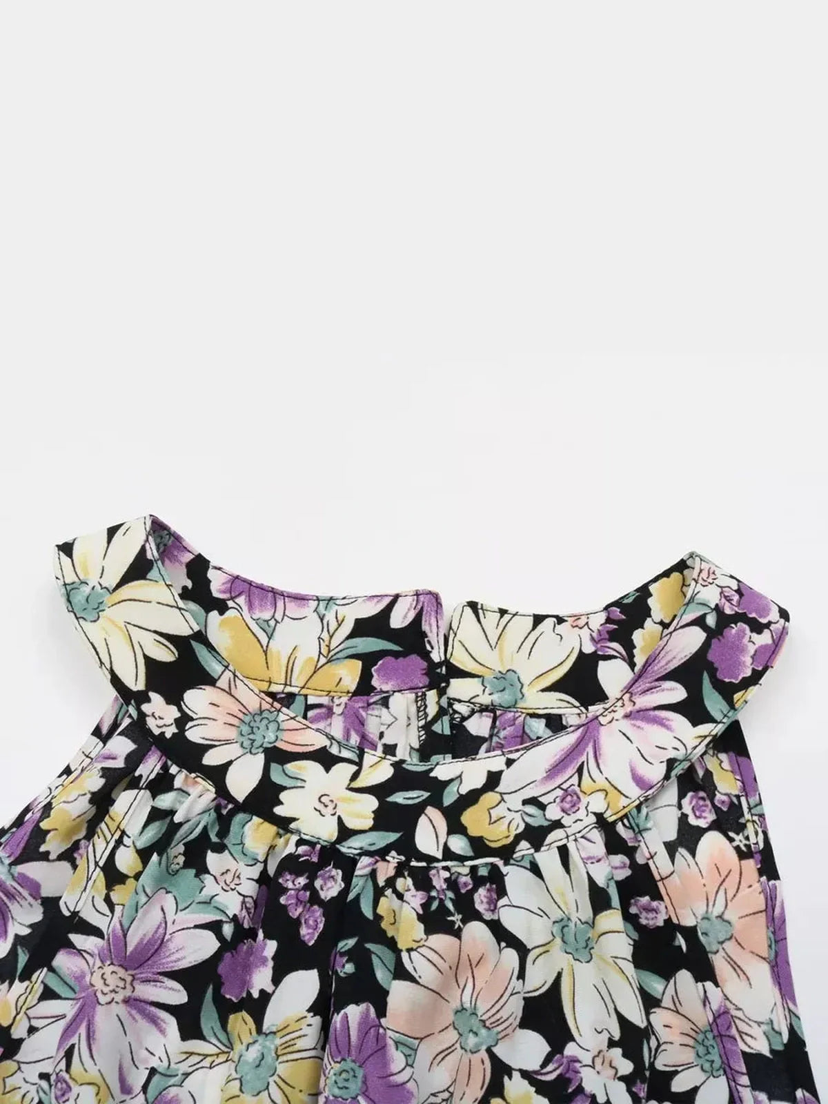 Top view of the Botanic Bloom Midi Dress featuring colorful floral patterns and a stylish halter neckline.