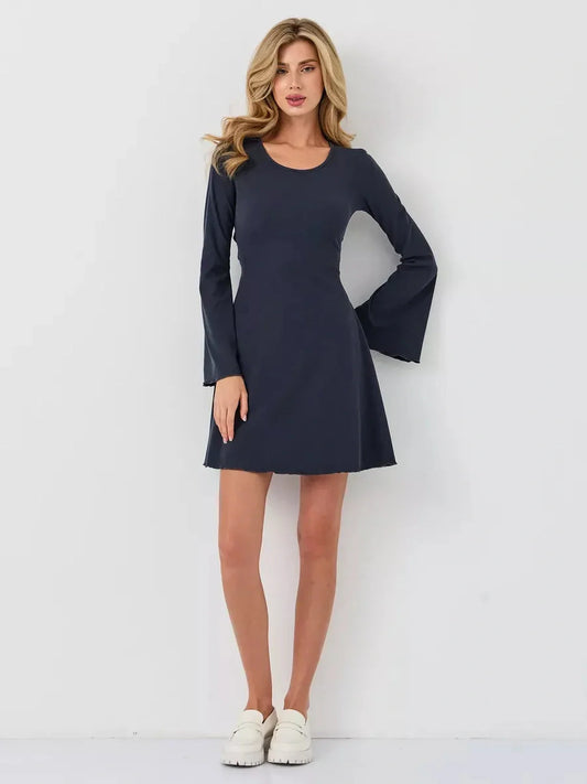 Confident woman in a navy mini dress with bell sleeves, perfect for summer, cocktail, or casual occasions.