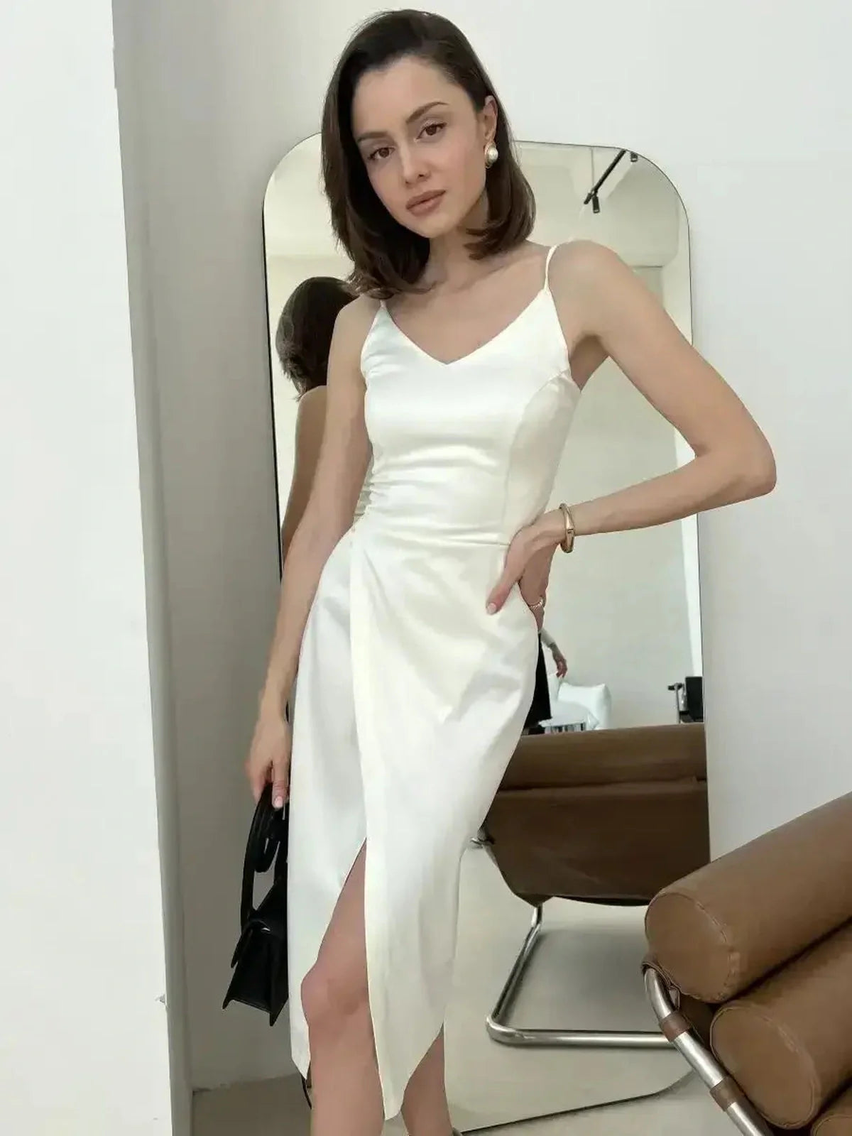 Ivory satin midi dress featuring a V-neckline and front wrap slit, perfect for weddings and formal events.