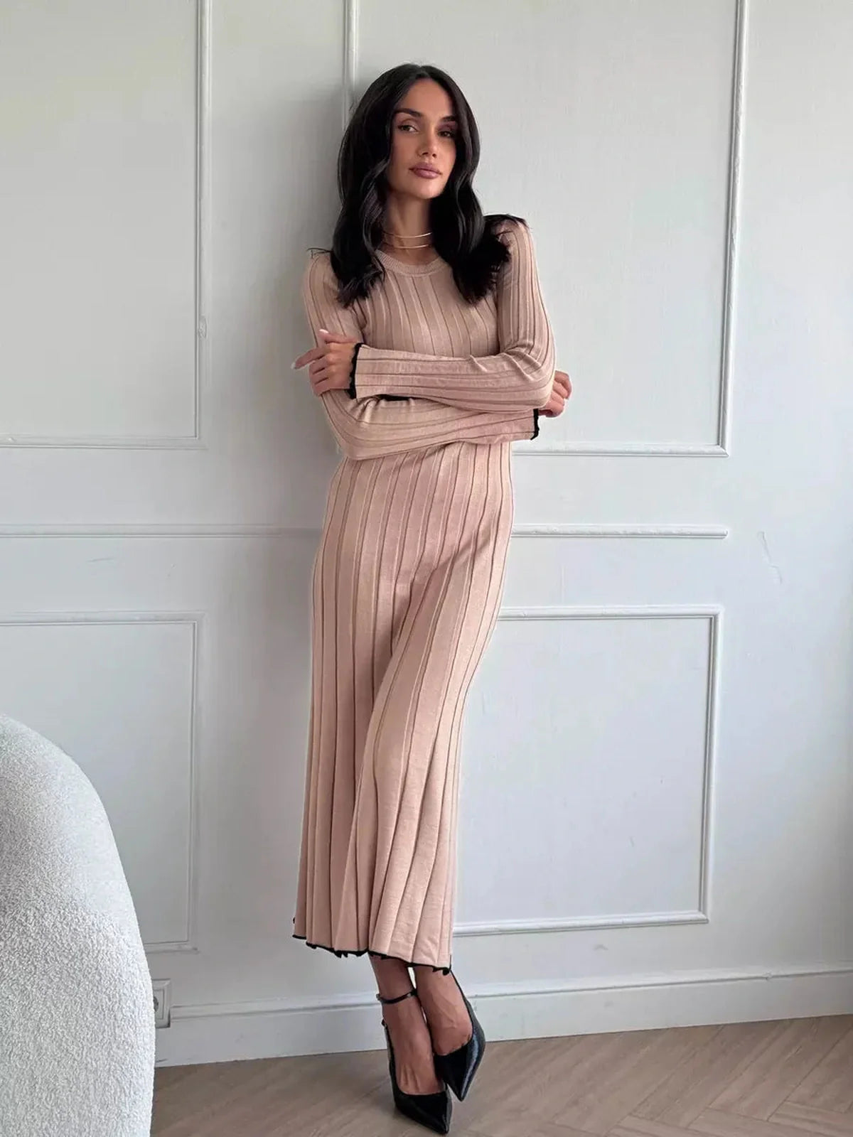 Sahara Curve Maxi Dress in sandstone beige, showcasing a figure-hugging silhouette with soft ribbed texture.