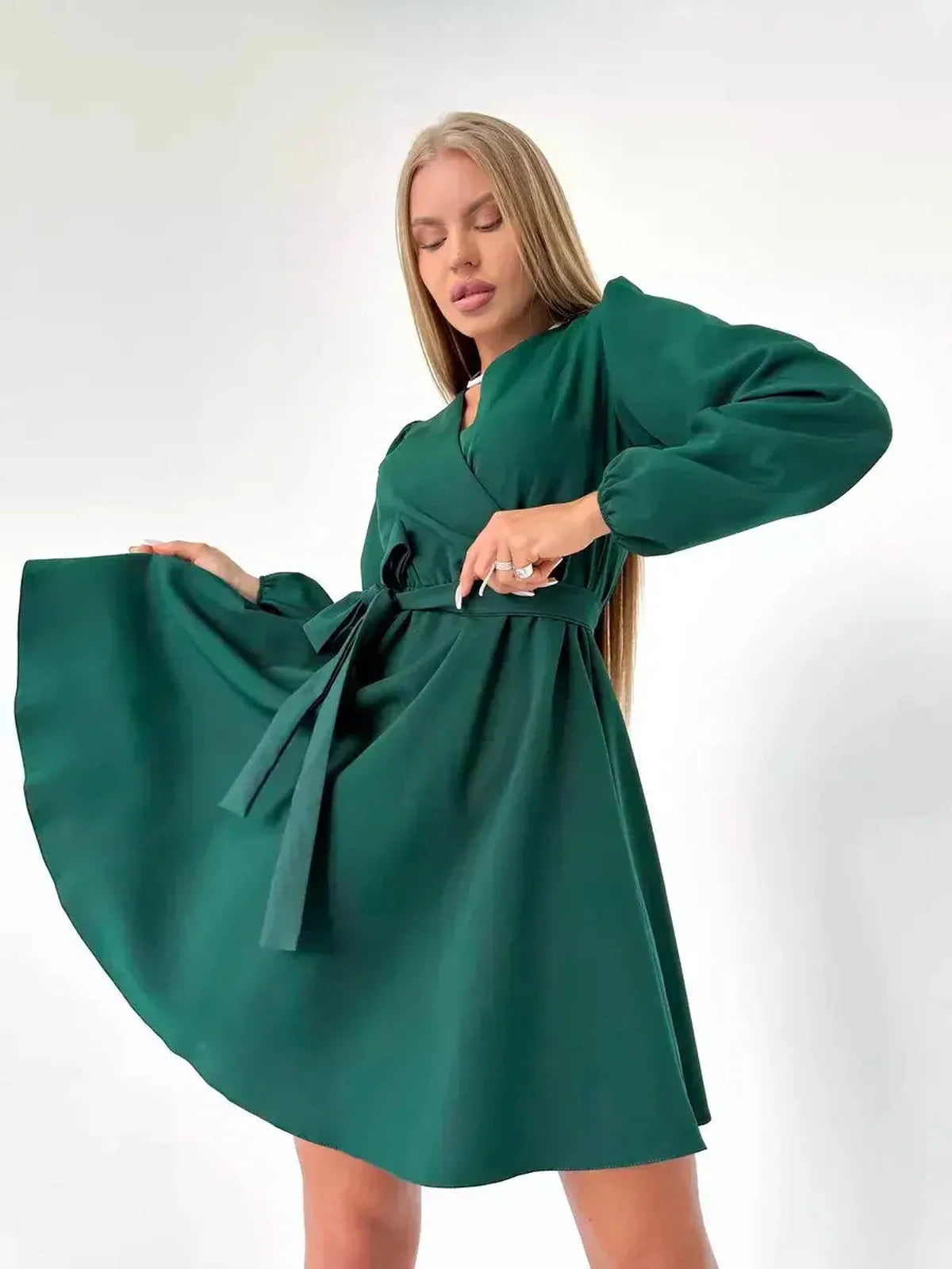 Emerald Charm mini dress featuring a V-neckline and wrap-style silhouette, perfect for summer weddings and special occasions.