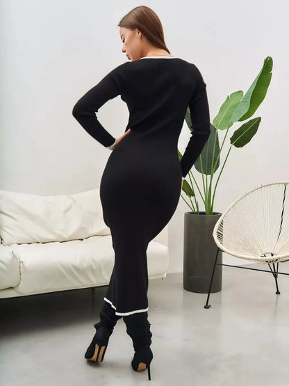 Elegant black midi dress with contrast trim, showcasing a chic silhouette and perfect for formal occasions.