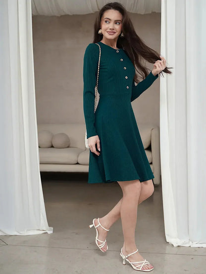Emerald Line mini dress featuring long sleeves, ribbed texture, and a button placket, perfect for weddings or homecoming.