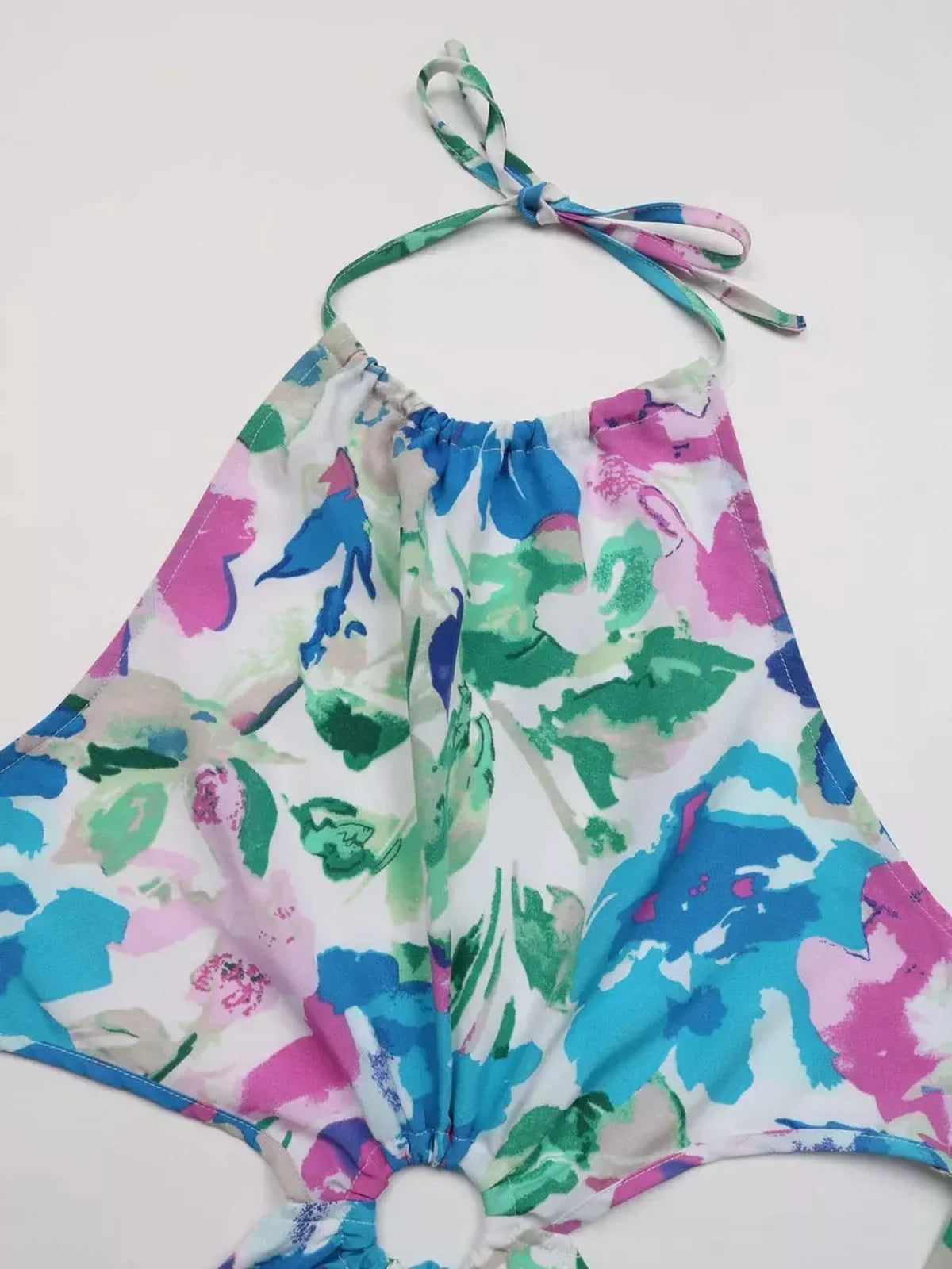 Vibrant petal bloom midi dress featuring a colorful watercolor-style floral print in pink, teal, and green hues.