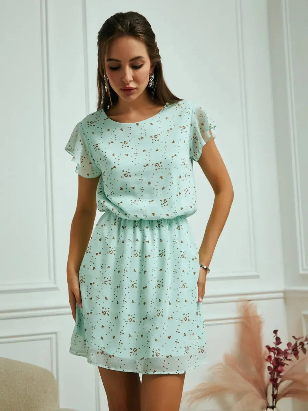 Mint Glow Mini Dress in airy chiffon with delicate mint hue, fluttery sleeves and cinched waist, perfect for summer occasions.