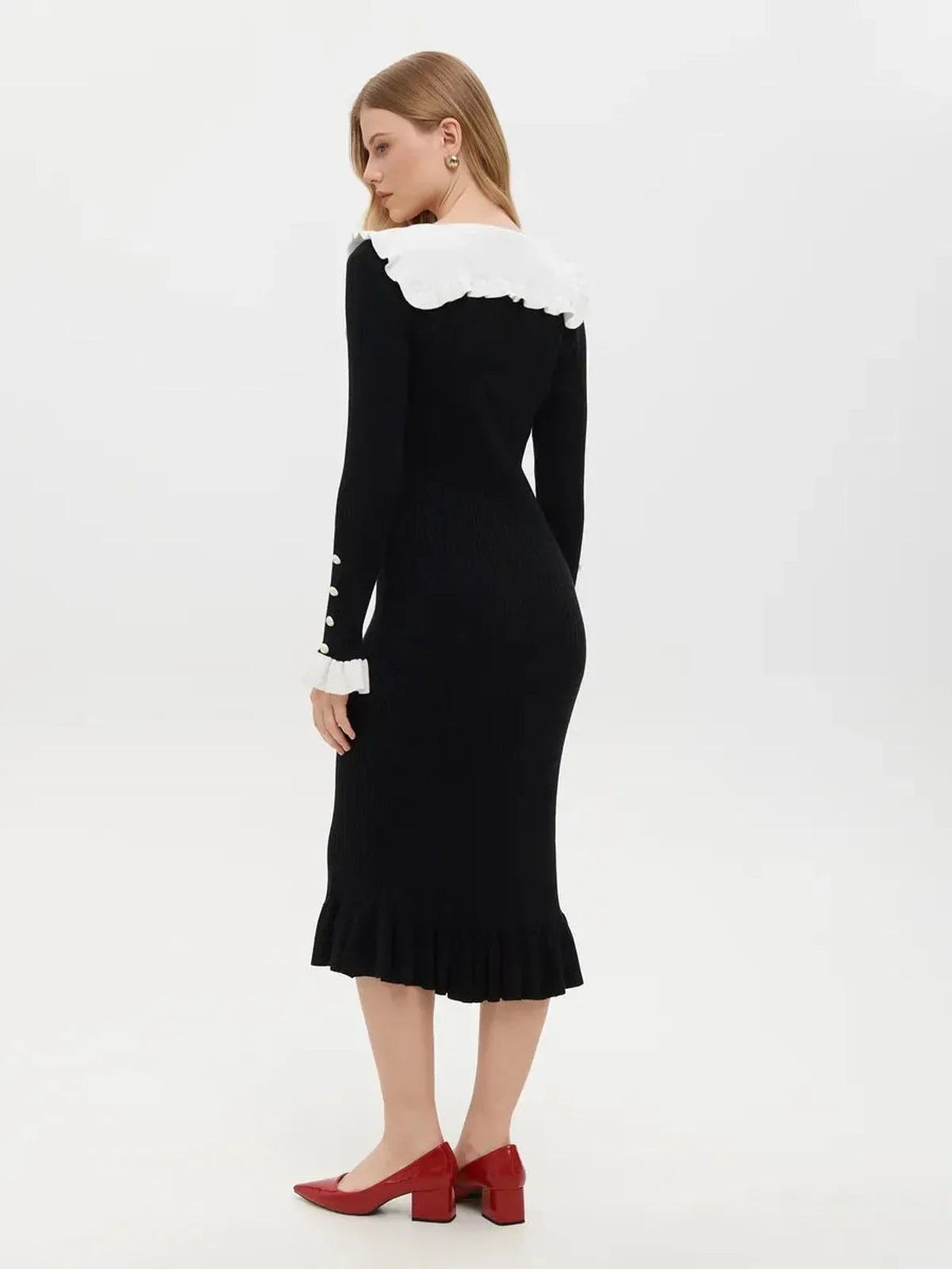 Elegant black midi dress with ruffle collar and cuffs, showcasing vintage romance for wedding guest or formal occasions.