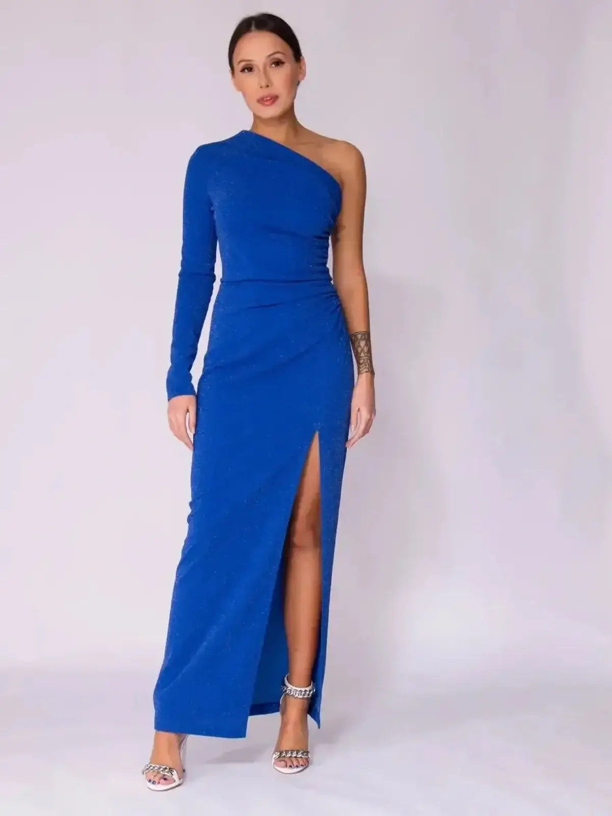 Sapphire Curve Maxi Dress featuring a one-shoulder design, thigh-high slit, and elegant electric blue fabric.