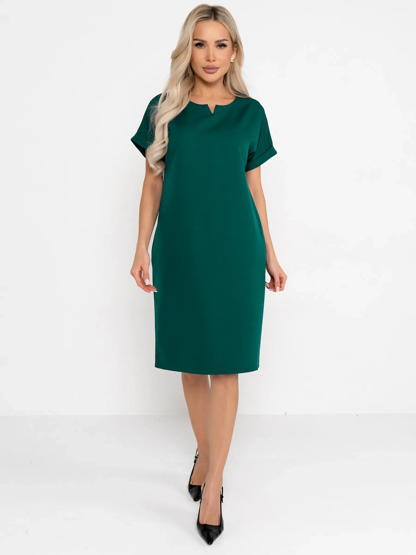 Emerald Mode green mini dress featuring cuffed sleeves and a notched neckline, perfect for weddings or formal events.
