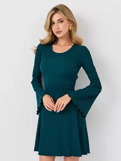 Emerald Whisper mini dress featuring long bell sleeves and a flared hem, perfect for weddings and summer events.