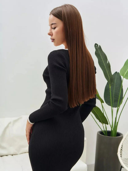 Model showcasing a sleek black Contrast Button Midi Dress, perfect for weddings and formal occasions.