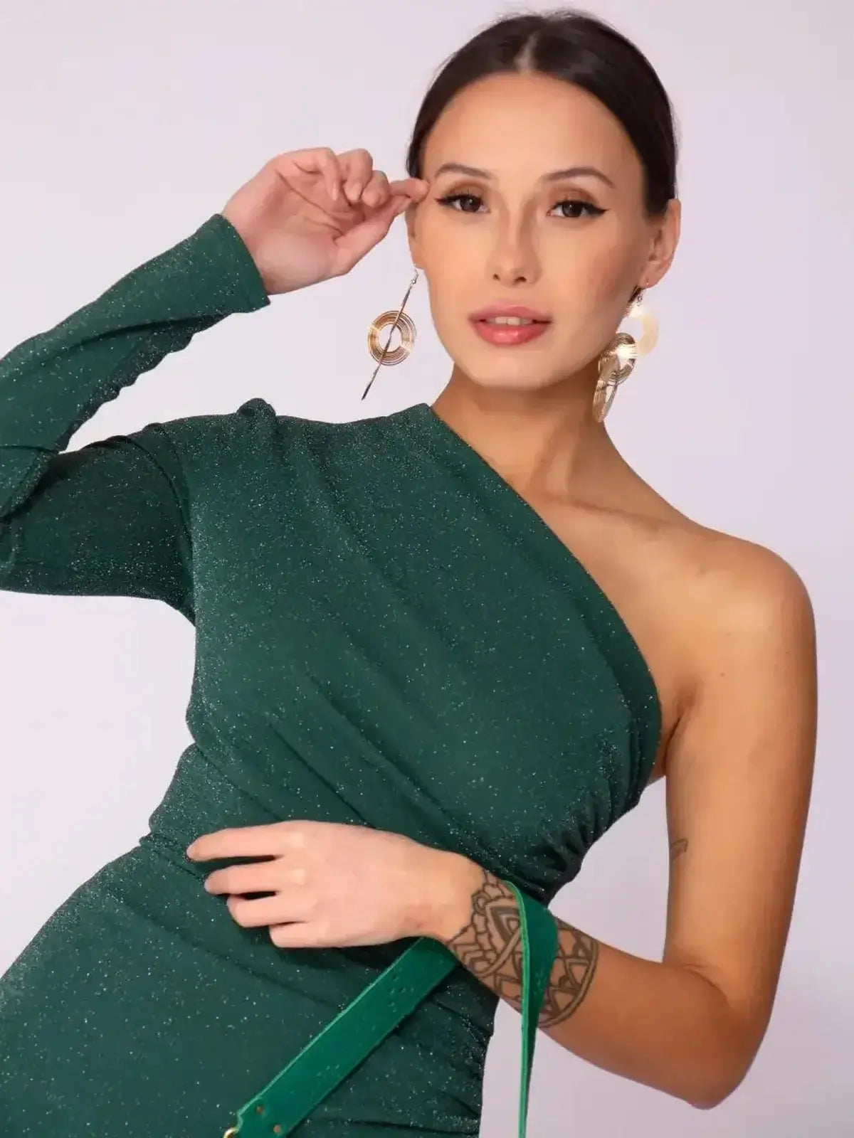 Emerald Spark Maxi Dress showcasing one-shoulder elegance with drape and shimmer, perfect for weddings and formal occasions.