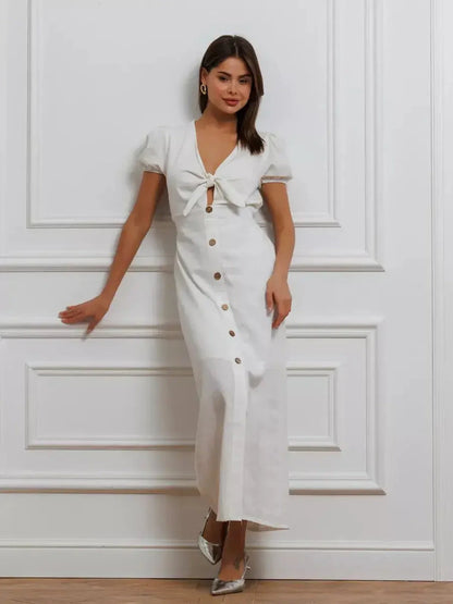 Maxi Dress Pearl Whisper featuring a tie-front, puff sleeves, and button-down skirt, perfect for summer and weddings.