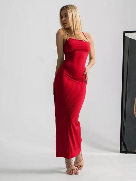 Model wearing a striking scarlet lace midi dress with spaghetti straps and a thigh-high slit.