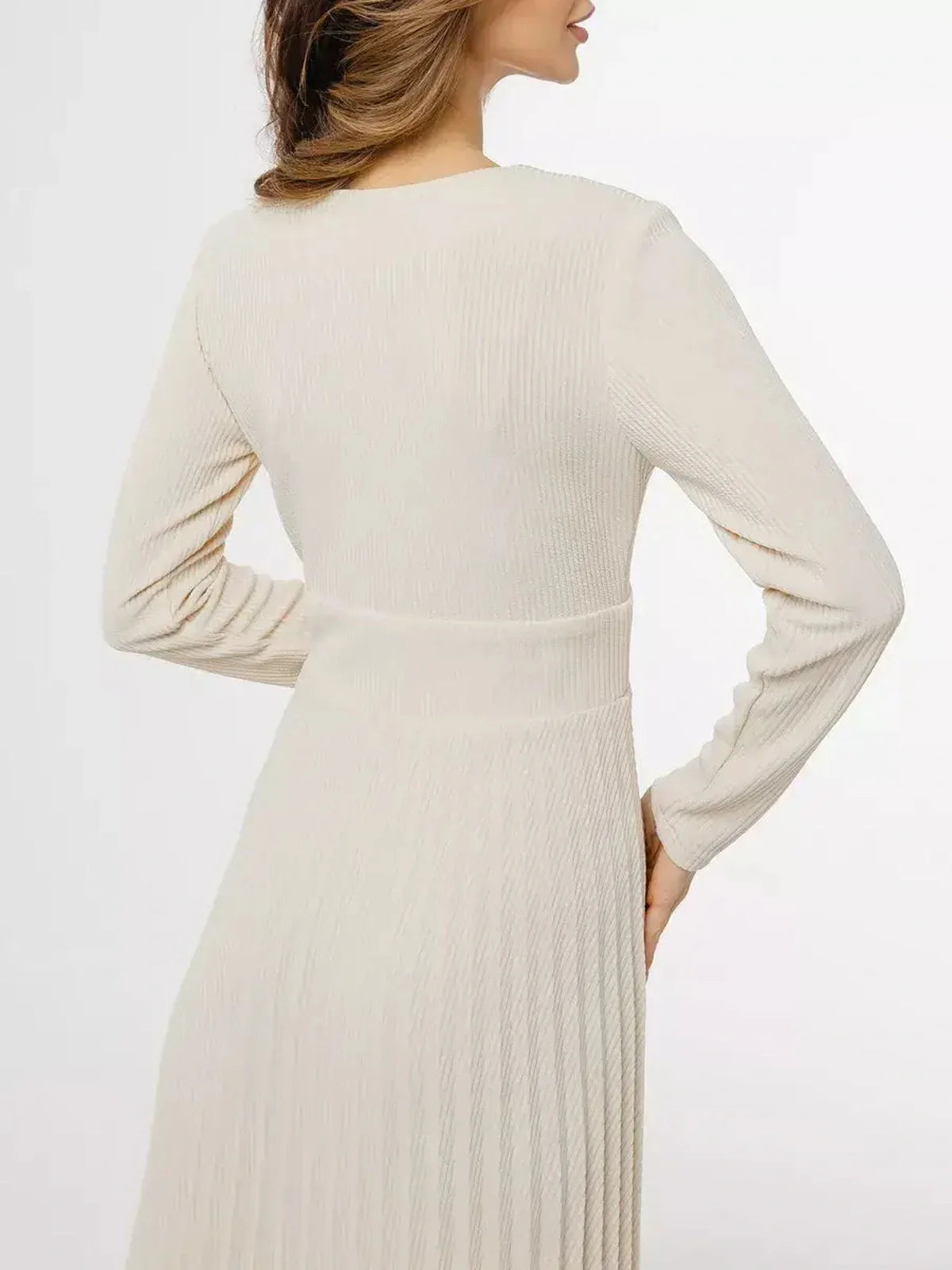 Back view of the Ivory Grace Midi Dress, showcasing its pleated design and tailored silhouette.