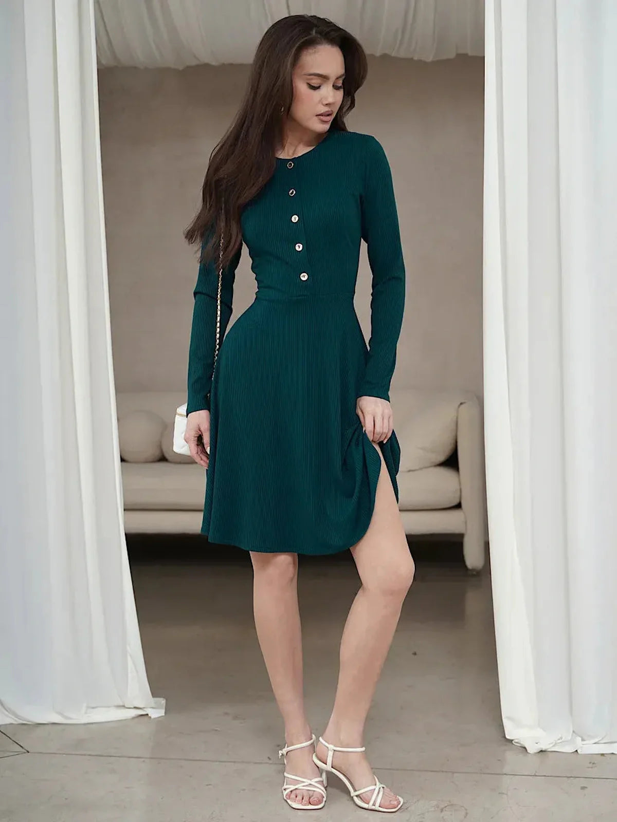 Emerald Line mini dress featuring a ribbed texture, long sleeves, and a flattering silhouette, perfect for weddings and formal events.