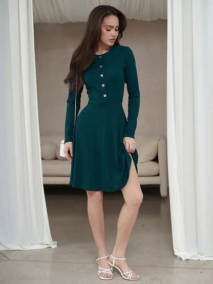 Emerald Line mini dress featuring a ribbed texture, long sleeves, and a flattering silhouette, perfect for weddings and formal events.
