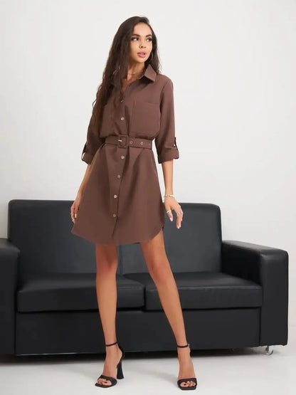 Chic brown mini dress with button-down front and belted waist, perfect for summer styling and special occasions.