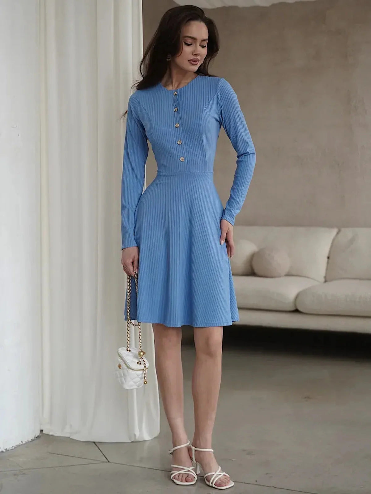 Skyline Muse mini dress in sky-blue, features long sleeves, button placket, and A-line fit, perfect for weddings or graduations.