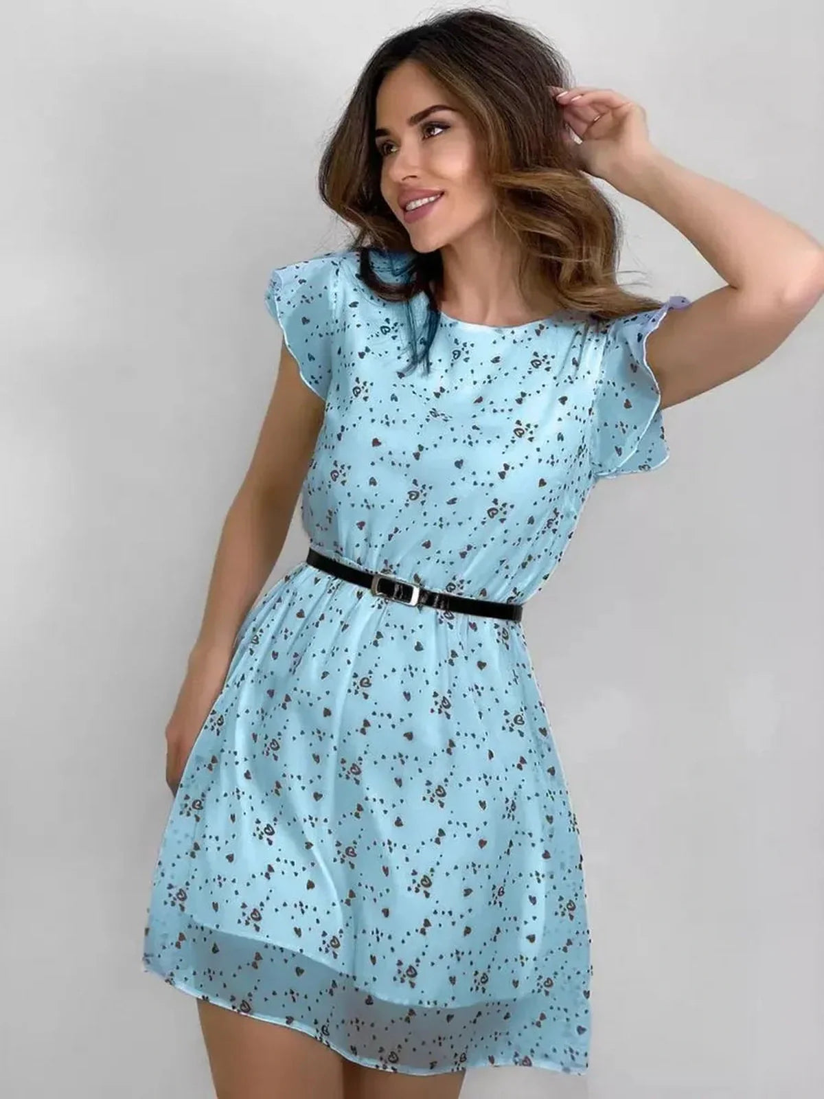 Sky Bloom Mini Dress in light blue with floral print, cinched waist, and flutter sleeves, perfect for summer occasions.