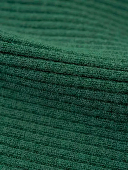 Close-up of textured forest green ribbed knit fabric for the Sculpted Knit Midi Dress.