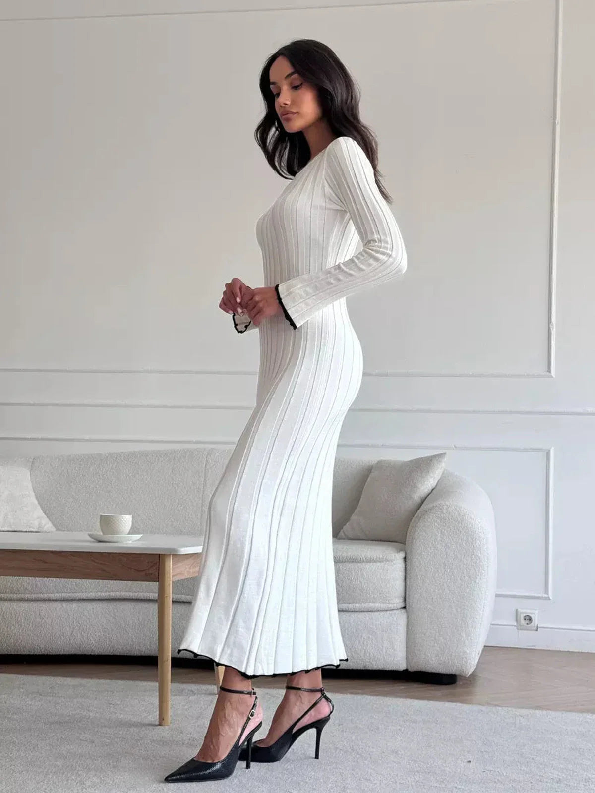 Model showcasing the Ivory Grace Maxi Dress, featuring ribbed texture and elegant design, ideal for day-to-night wear.