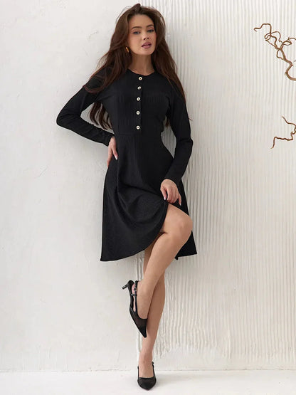 Elegant Mod Noir black mini dress with long sleeves and button detail, ideal for wedding guests and formal occasions.
