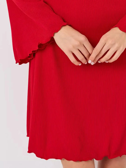 Close-up of a red flare cutout mini dress showcasing textured fabric and stylish ruffled hem details.