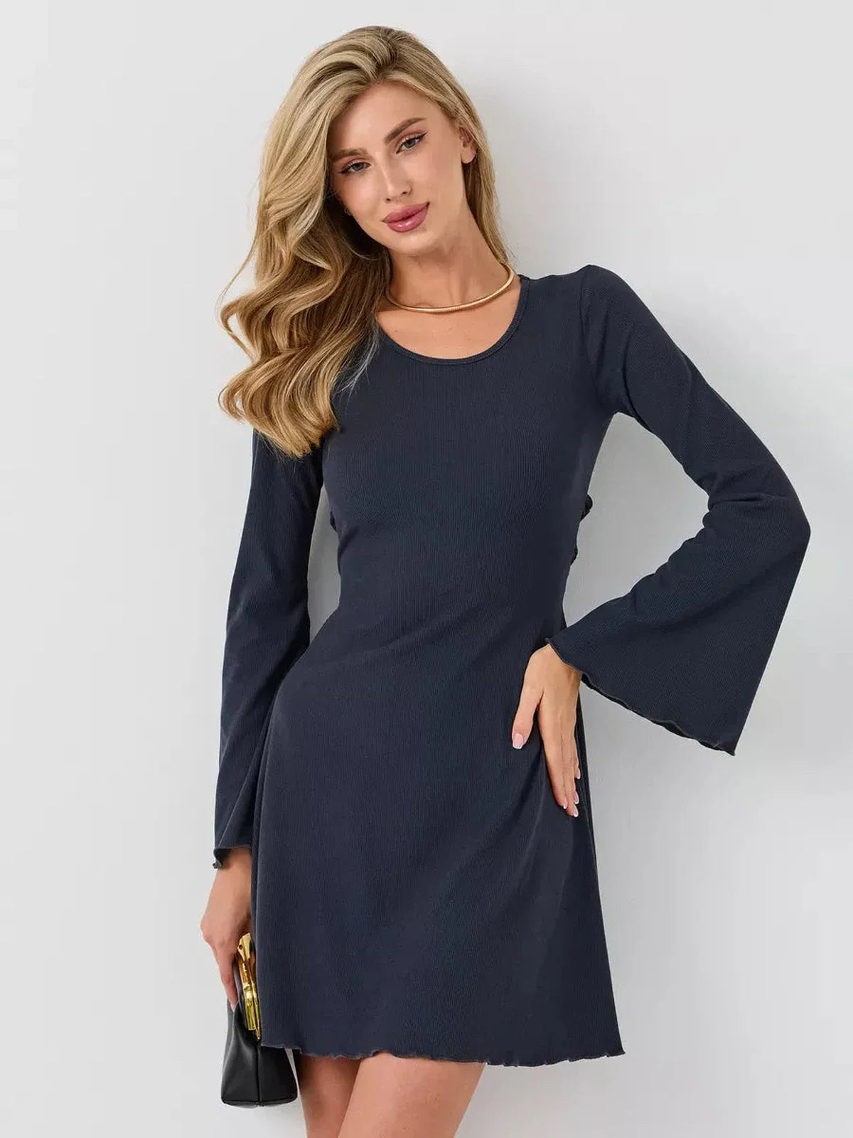 Graphite Grace mini dress featuring long bell sleeves and a flattering fit, perfect for cocktail and summer occasions.