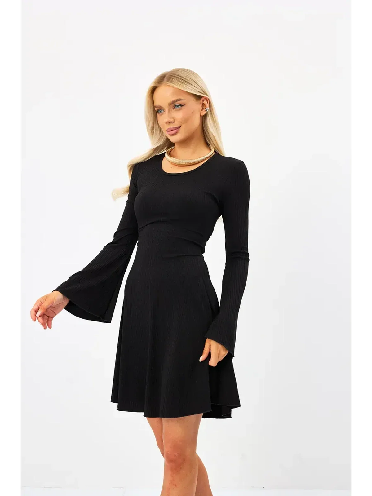 Flare Charm Mini Dress in black with ribbed texture and fluted sleeves, perfect for summer or cocktail events.