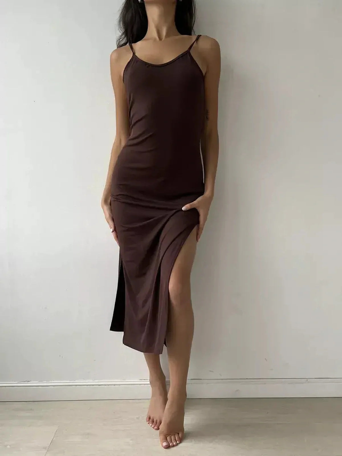 Noir Muse Midi Dress in deep chocolate satin featuring a seductive side slit and minimalist straps, perfect for special occasions.