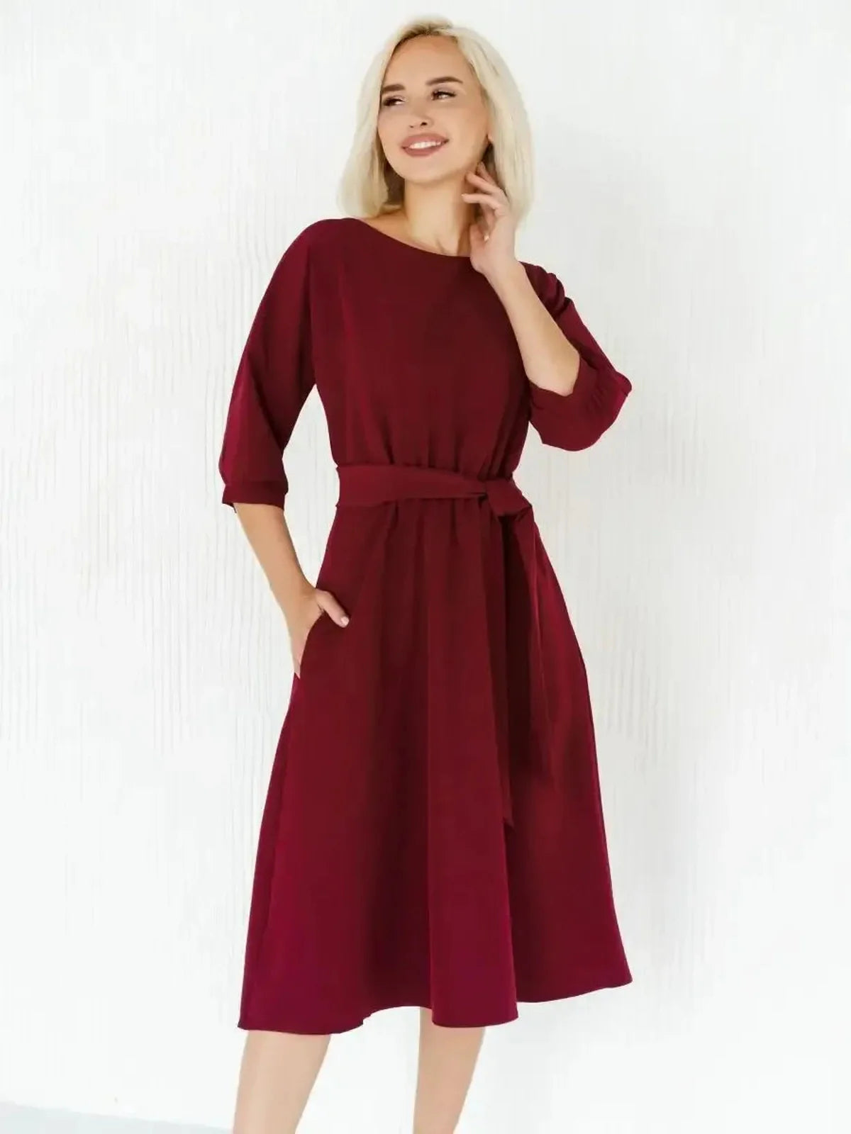 Elegant crimson midi dress with a self-tie belt, featuring a flowing silhouette perfect for formal or casual occasions.