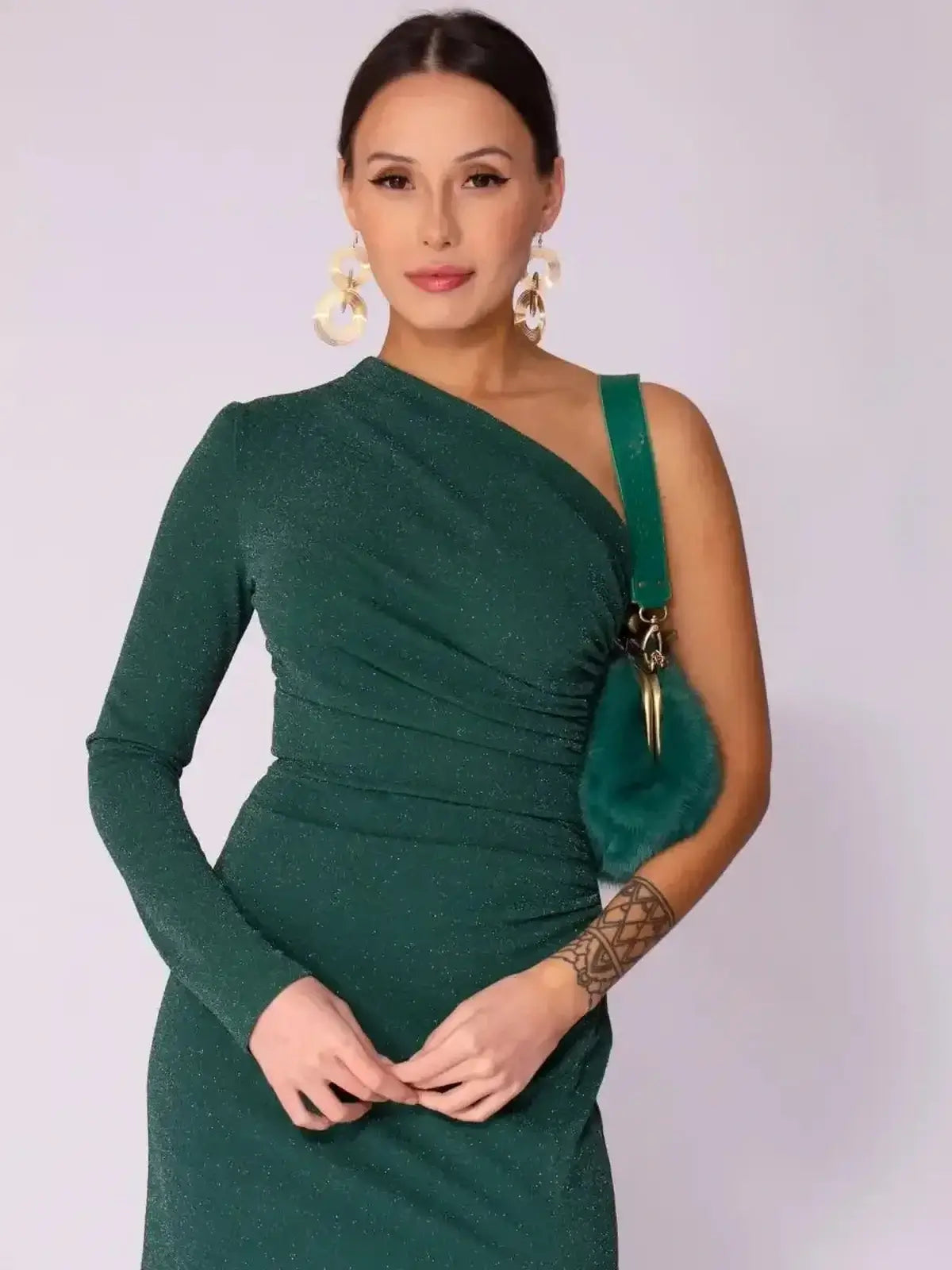 Emerald Spark Maxi Dress featuring one-shoulder design and shimmer, ideal for weddings and formal events.