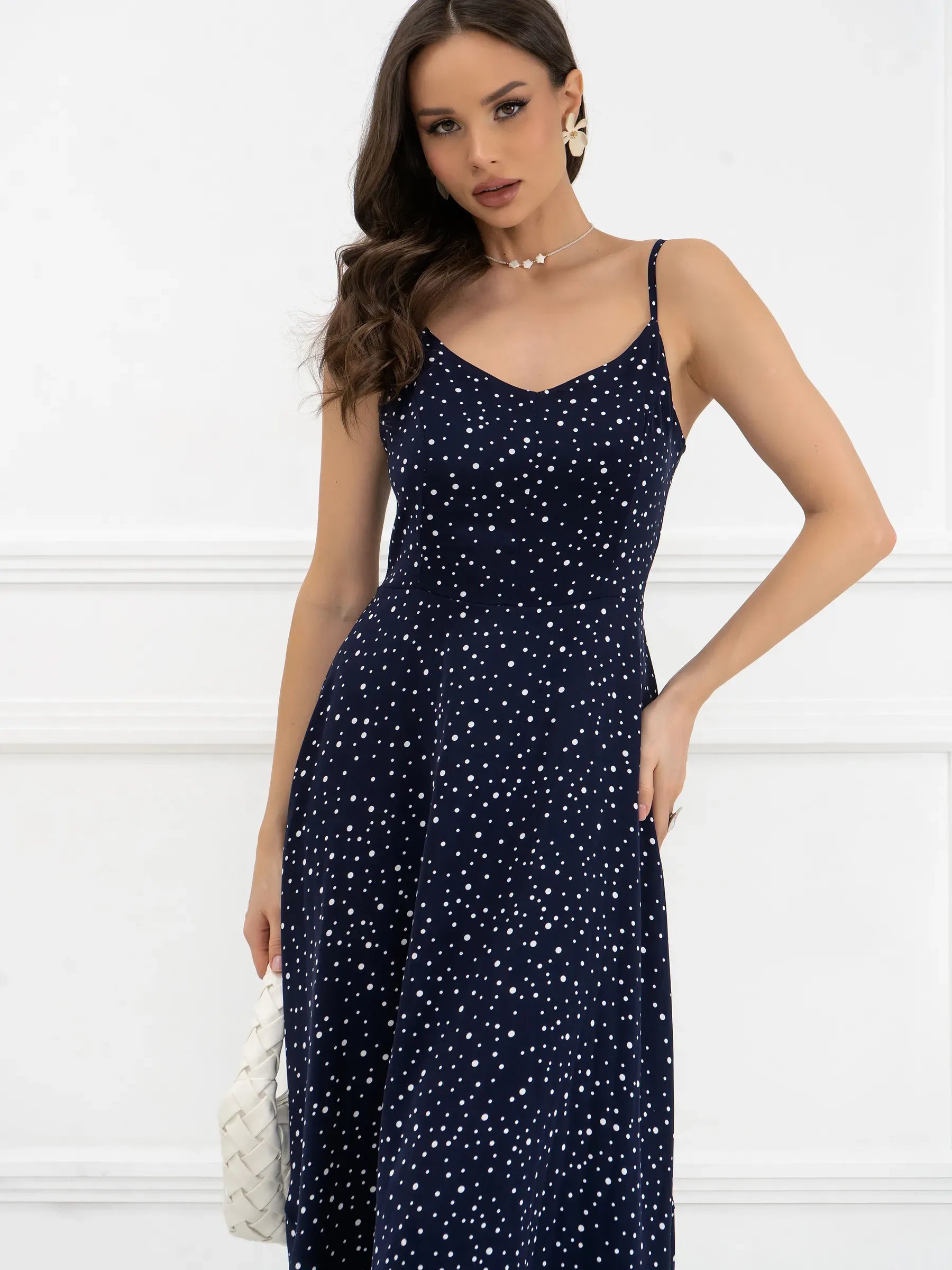 Noir Dots Maxi Dress featuring a flattering A-line cut and micro-polka dot pattern, perfect for weddings or formal occasions.