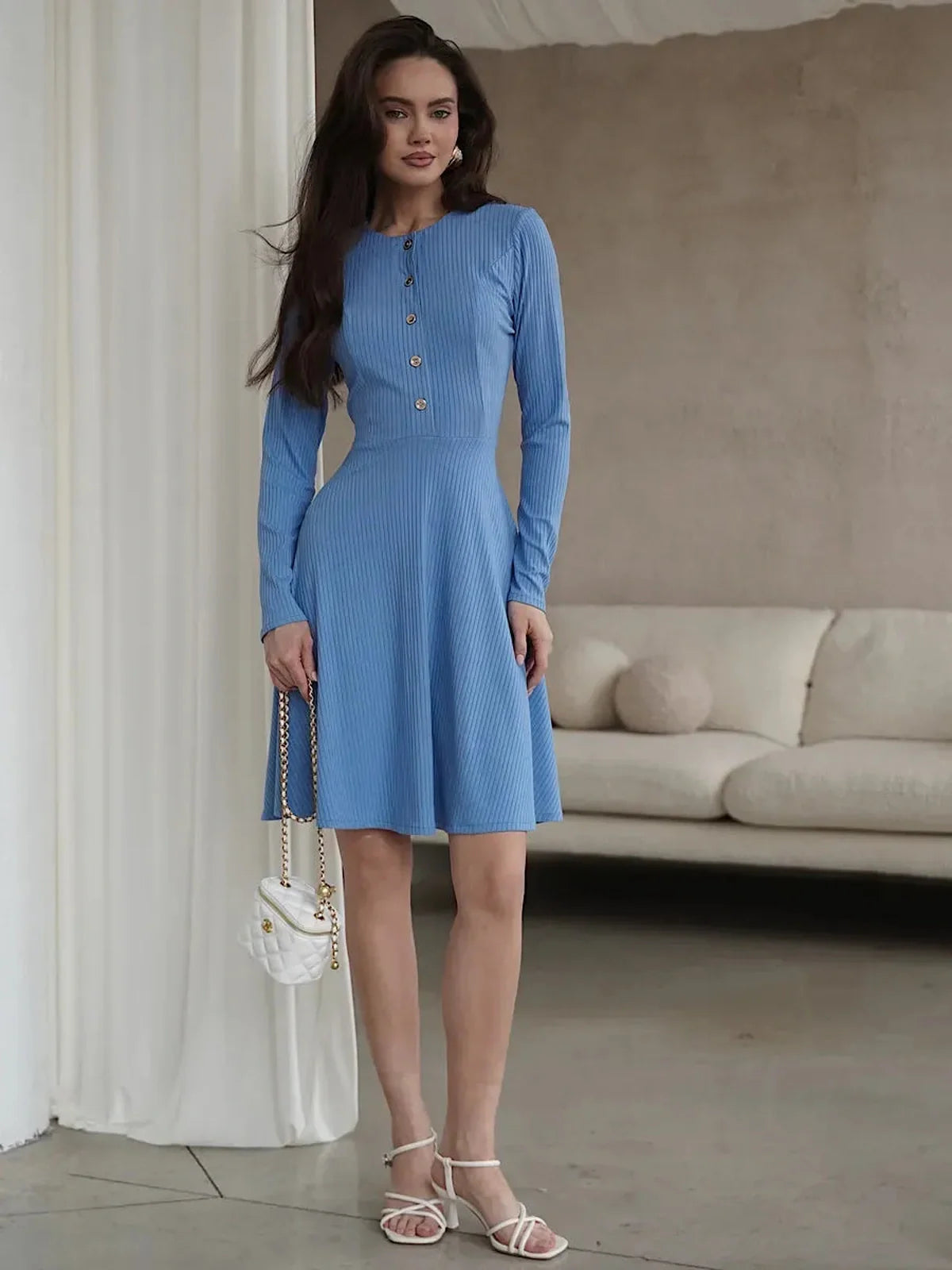Skyline Muse mini dress in sky blue, featuring long sleeves, button placket, and a flattering A-line silhouette.