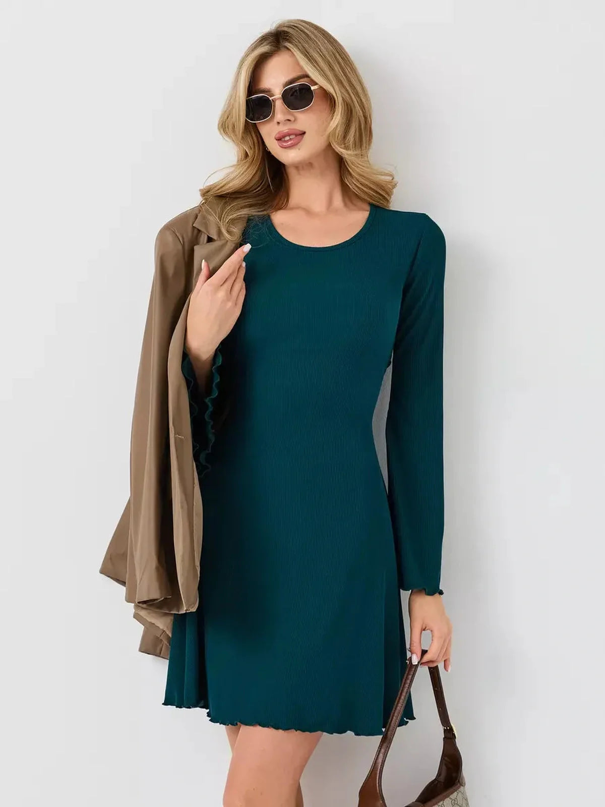 Emerald Whisper mini dress in deep green, perfect for summer weddings and cocktail events, featuring a flattering A-line silhouette.