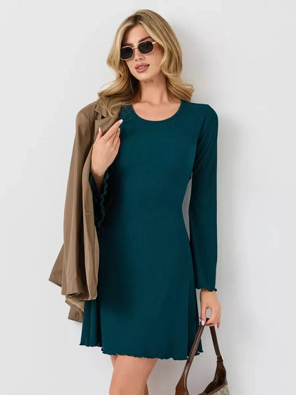 Emerald Whisper mini dress in deep green, perfect for summer weddings and cocktail events, featuring a flattering A-line silhouette.