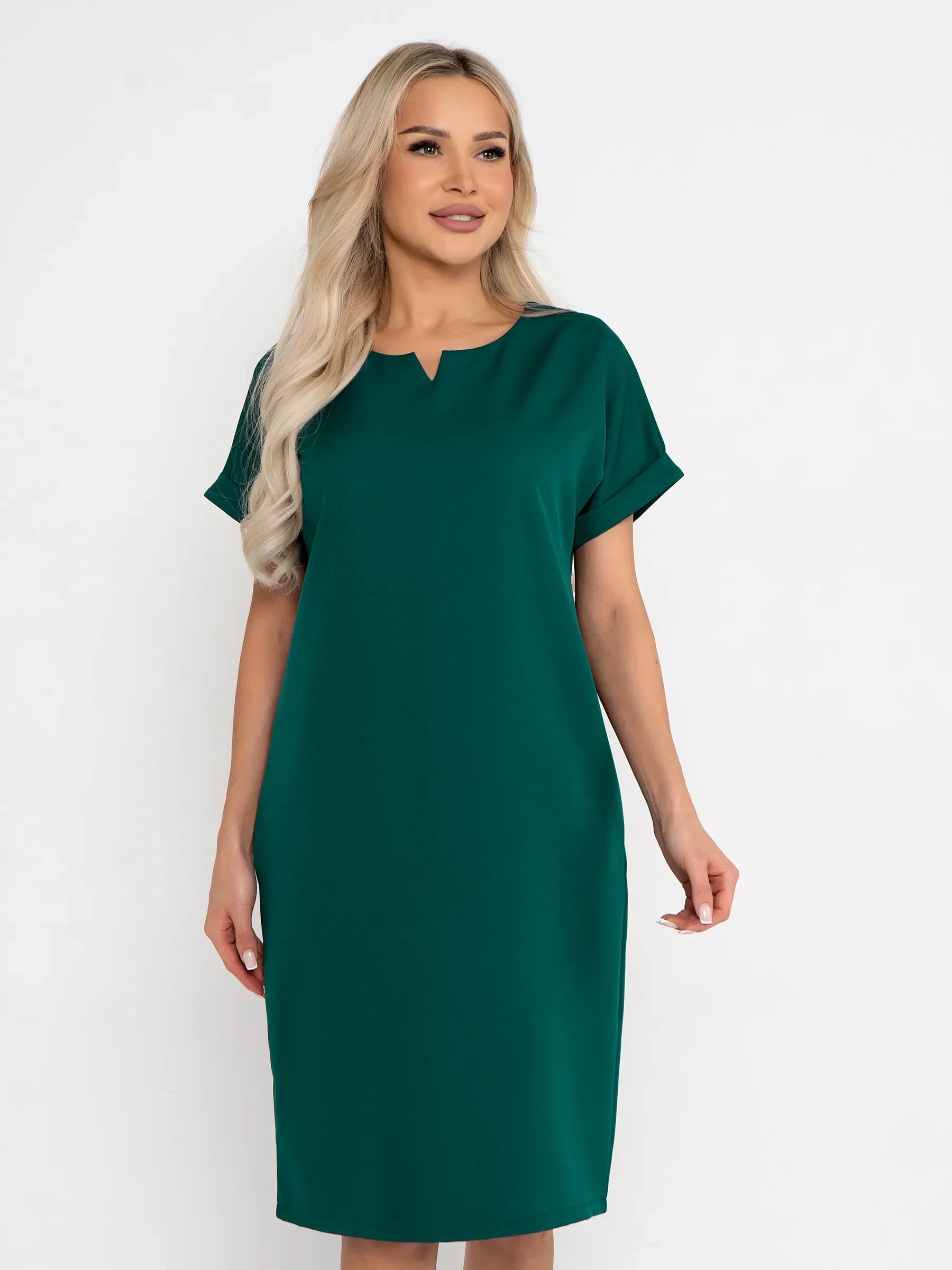 Emerald Mode green mini dress with notched neckline and cuffed sleeves, perfect for weddings and summer events.