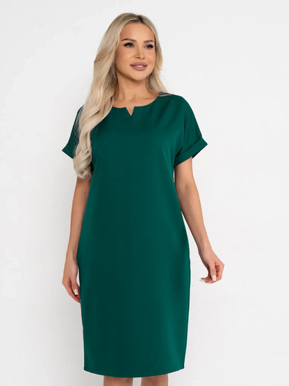 Emerald Mode green mini dress with notched neckline and cuffed sleeves, perfect for weddings and summer events.