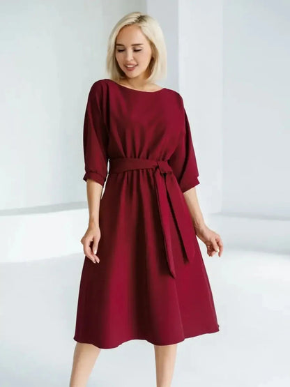 Crimson Grace Midi Dress in burgundy with A-line skirt and self-tie belt, perfect for weddings and formal events.