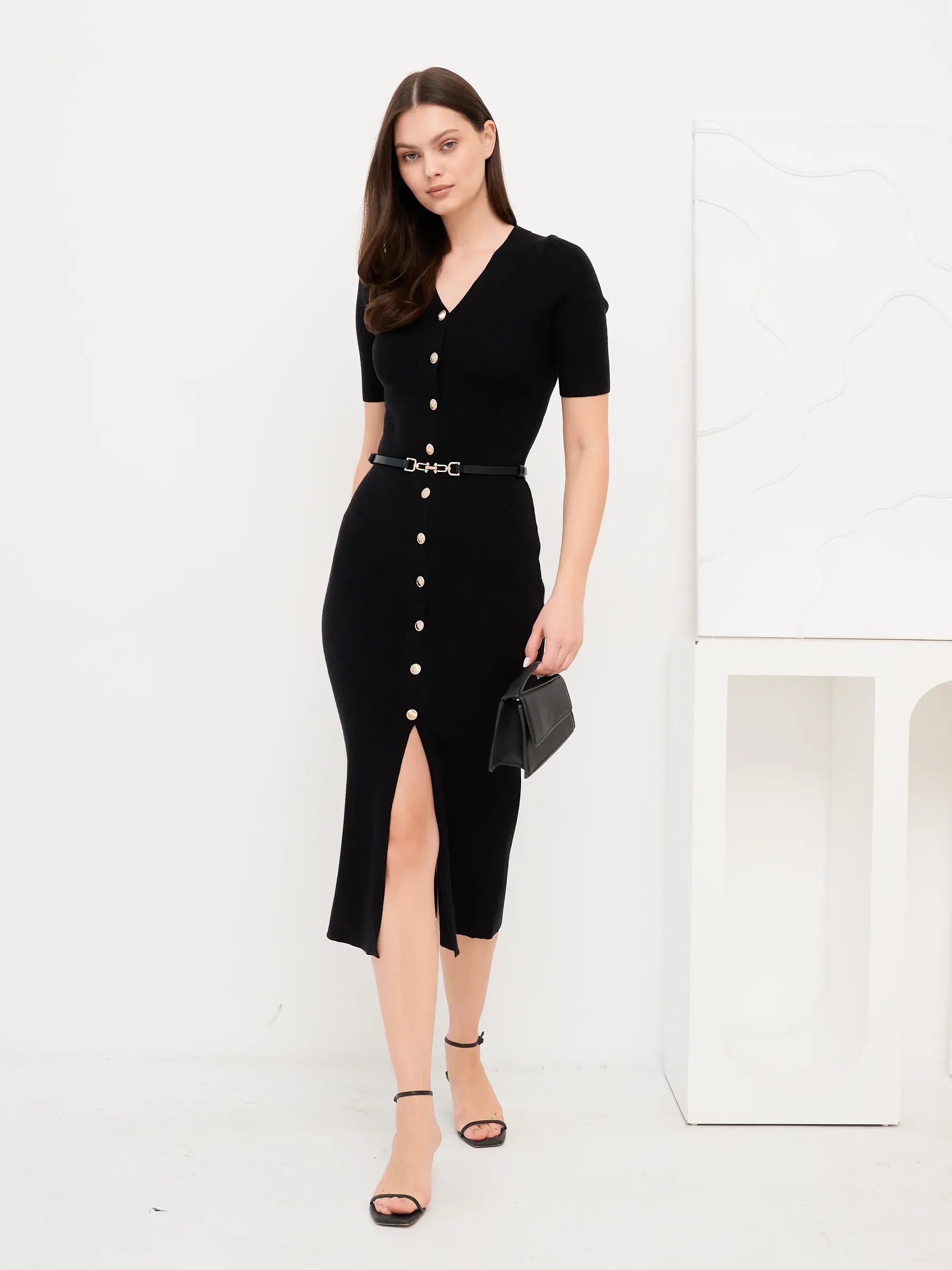 Sculpted Grace Midi Dress in black with gold button detail and belted waist, showcasing modern elegance for formal occasions.