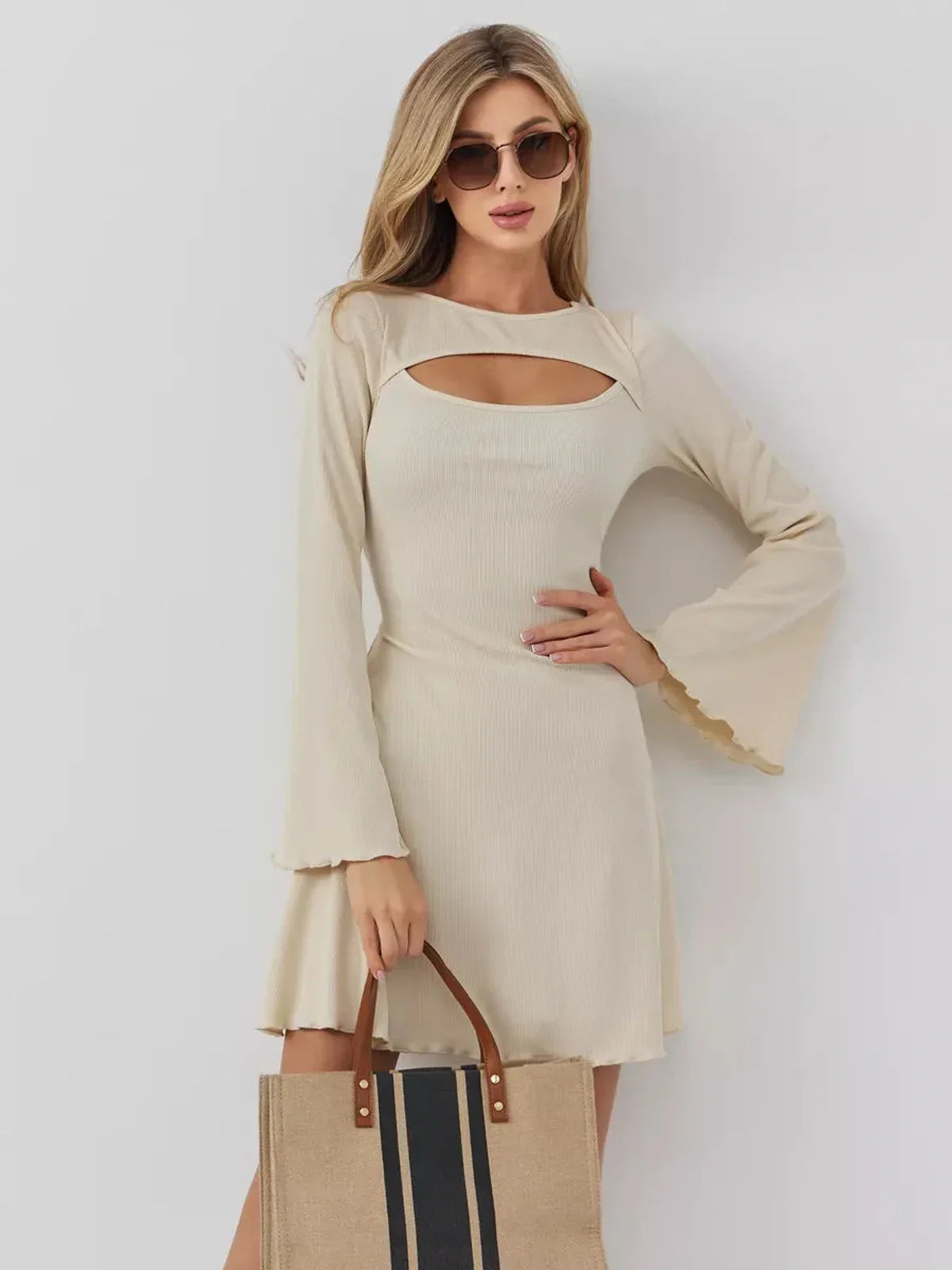 Sculpted Grace mini dress featuring a boat neckline and front cutout, perfect for weddings or casual outings.