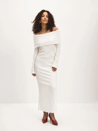 Sculpted Grace Maxi Dress in white with off-shoulder neckline, featuring a side slit, perfect for weddings and formal events.