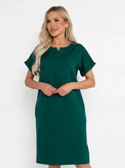 Emerald Mode green mini dress featuring a notched neckline and cuffed sleeves, ideal for summer events and weddings.